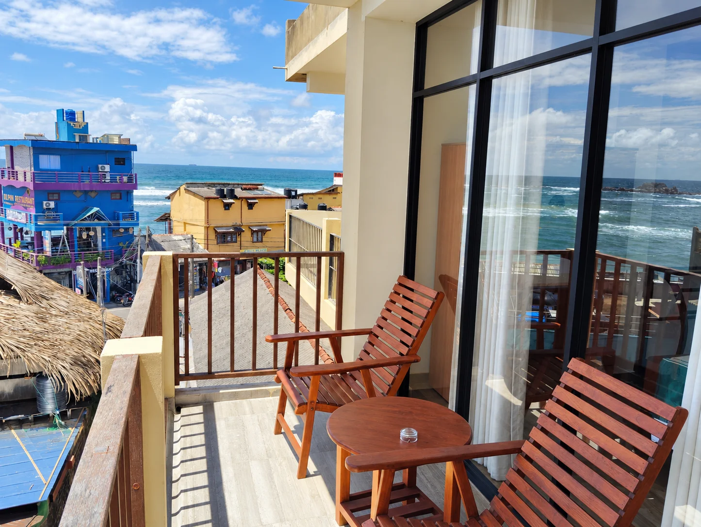 Private Balcony with Wooden Seating and Ocean Views