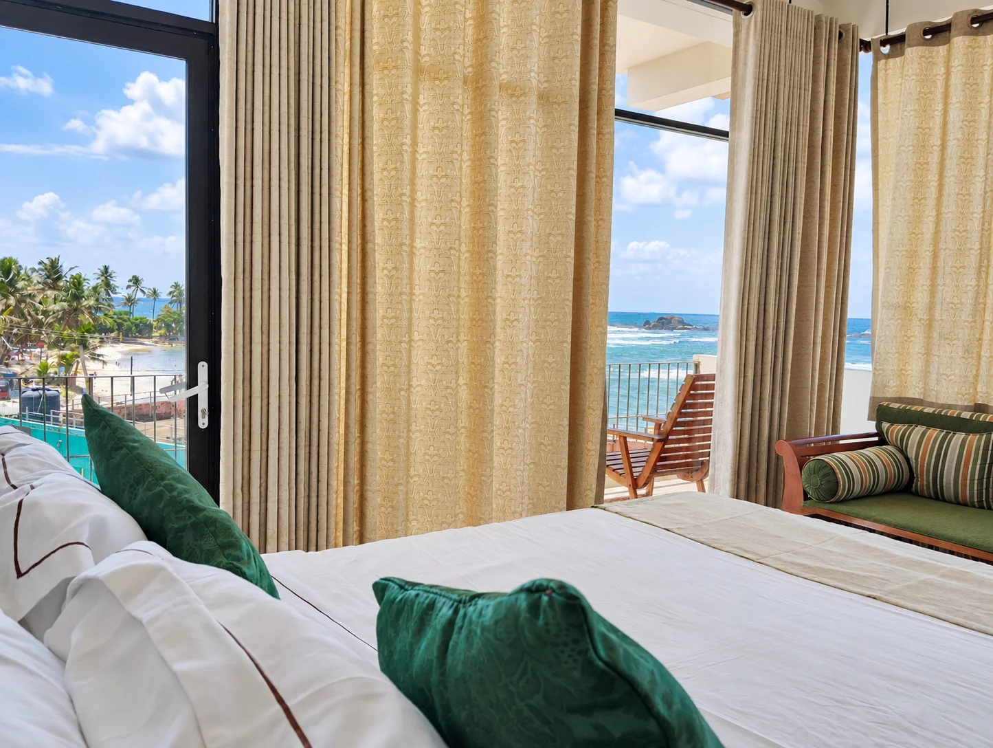 Comfortable Bedroom with Private Balcony and Sea Views