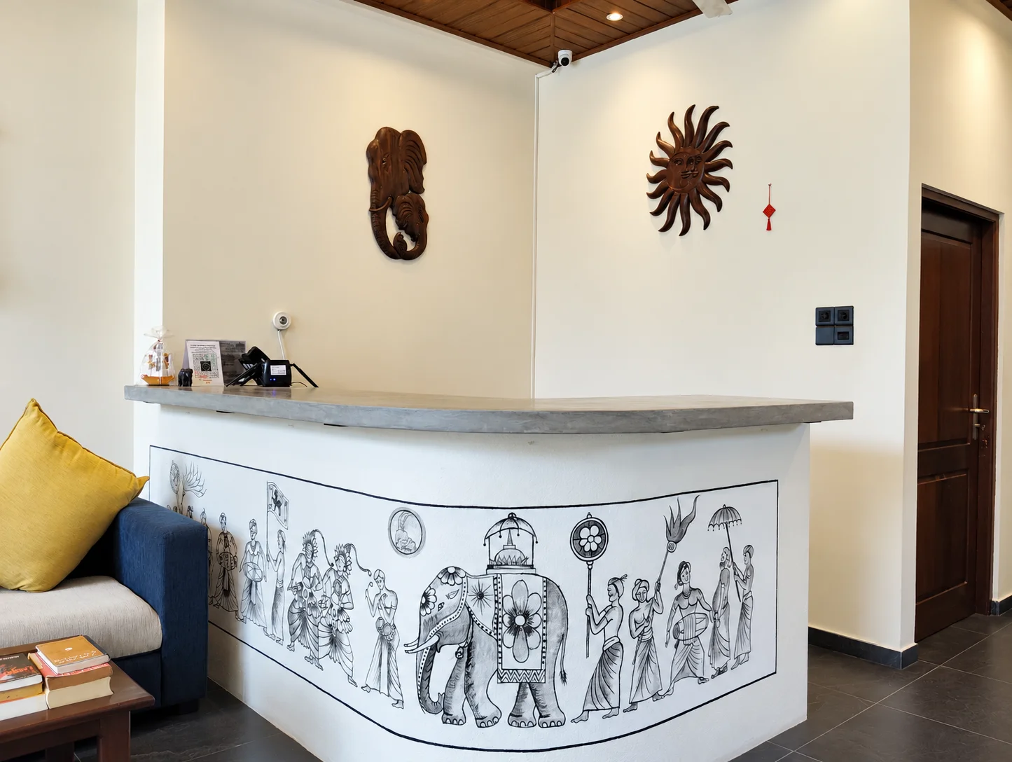 Warm hotel reception with elephant artwork
